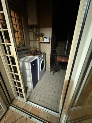 a washer and dryer sitting in a room at Tatyana appartament in Rome