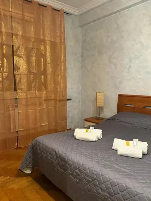 a bedroom with a bed with towels on it at Tatyana appartament in Rome
