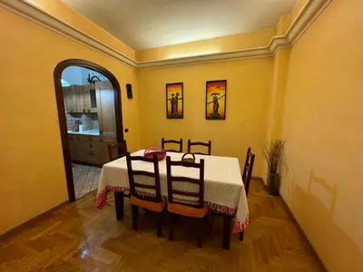 a dining room with a table and two chairs at Tatyana appartament in Rome