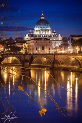 a view of a building with a bridge over a river at Tatyana appartament in Rome