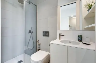 a bathroom with a shower and a toilet and a sink at Modern flat in Vatican in Rome