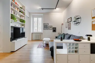 a living room with a couch and a tv at Modern flat in Vatican in Rome