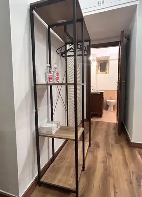 a book shelf in a room with a bathroom at Love Roma Termini Apartment with Terrace in Rome