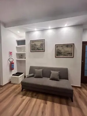 a living room with a couch in a room at Love Roma Termini Apartment with Terrace in Rome