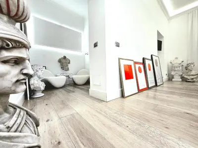 a museum with a statue and paintings in a room at B89 Luxury Gallery House Piazza Di Spagna in Rome
