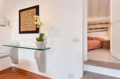 a glass table in a room with a bedroom at Rome as you feel - Baullari with terrace in Rome