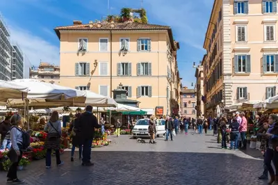a crowd of people walking around a market in a city at Rome as you feel - Baullari with terrace in Rome