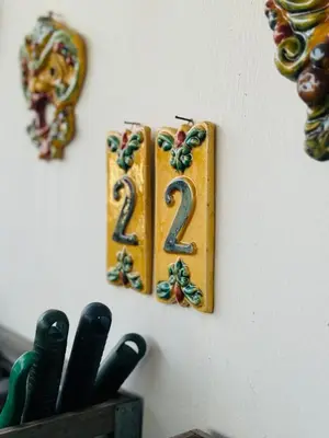 a clock on a wall with a number on it at 22APT Luxury quiet loft with terrace in Rome