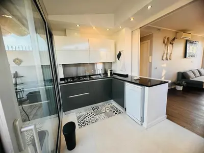 a kitchen with a counter and a glass wall at 22APT Luxury quiet loft with terrace in Rome
