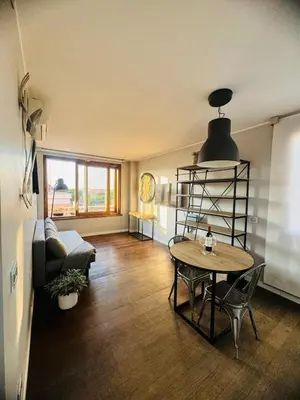 a living room with a table and a couch at 22APT Luxury quiet loft with terrace in Rome
