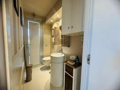 a small bathroom with a toilet and a sink at 22APT Luxury quiet loft with terrace in Rome