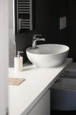 a white sink on a counter in a bathroom at Alloggio per uso turistico Roma Casal Bertone - Casa del Sole in Rome
