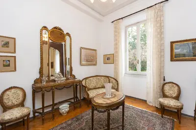 a room with a mirror and a table and chairs at Amazing San Giovanni in Laterano in Rome