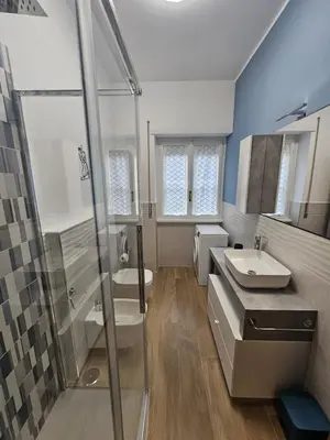 a bathroom with a shower and a sink at La casa di Ricky in Rome