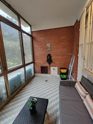 a living room with a couch and a table at La casa di Ricky in Rome