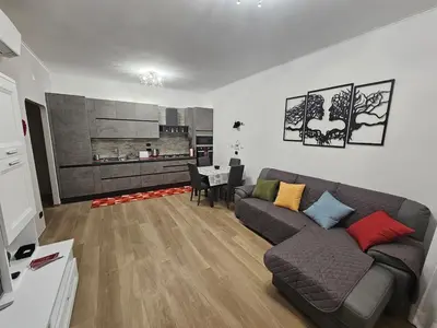 a living room with a couch and a table at La casa di Ricky in Rome