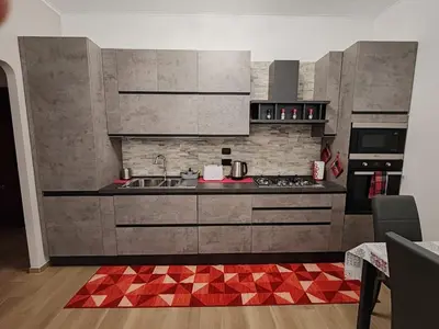 a kitchen with a sink and a stove at La casa di Ricky in Rome