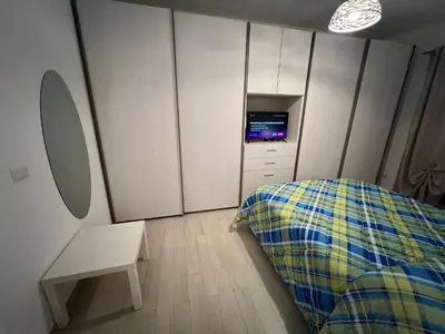 a bedroom with a bed and a tv in it at Casa Caffarella in Rome
