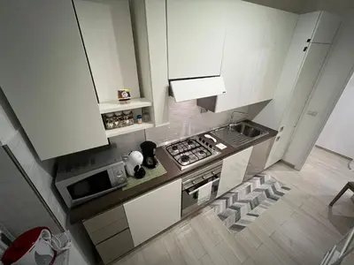 an overhead view of a kitchen with white cabinets at Casa Caffarella in Rome