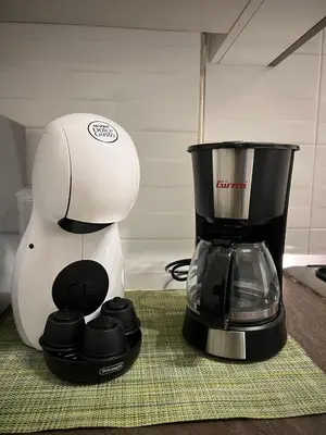 a white and black blender sitting on top of a counter at Casa Caffarella in Rome