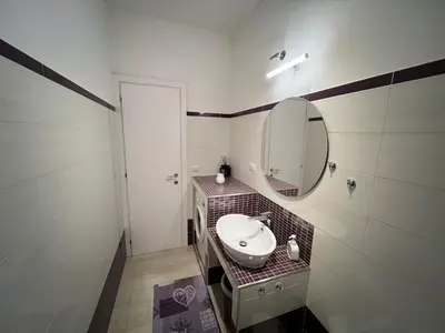 a bathroom with a sink and a mirror at Casa Caffarella in Rome