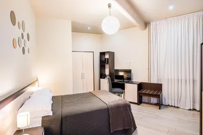 a bedroom with a bed and a desk at Interno5 in Rome