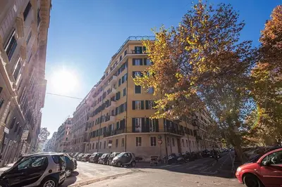 a building on a city street with cars parked in front at Interno5 in Rome