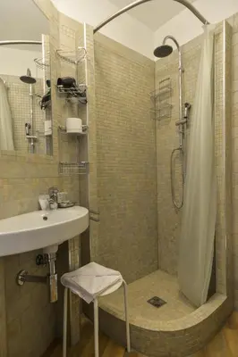 a bathroom with a sink and a shower at Lata Luxury Apartment in Rome