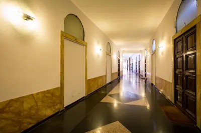 a hallway with a door and a tile floor at Lata Luxury Apartment in Rome