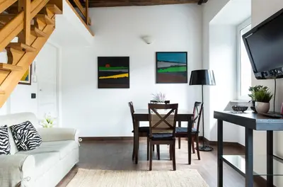 a living room with a table and a couch at Casa Enriqueta in Rome