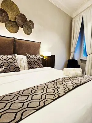 a bedroom with a bed and a window at STOA ROME Boutique Suites in Rome