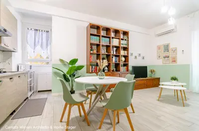 a kitchen and dining room with a table and chairs at Acquedotti House in Rome