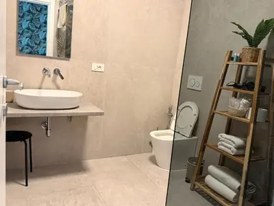 a bathroom with a sink and a toilet at Luxury Jacuzzi Suites Rome - You Rhome in Rome