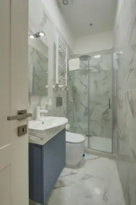 a bathroom with a shower and a sink and a toilet at Vatican Lante Apartment in Rome