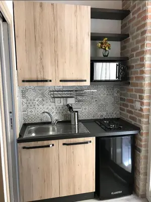 a kitchen with a sink and a stove at Suite Old Testaccio 2 in Rome