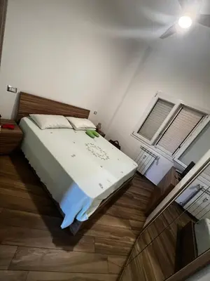 a bedroom with a bed and two windows at Nathan House, Tuscolana in Rome