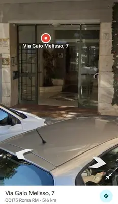 a car parked in front of a building at Nathan House, Tuscolana in Rome
