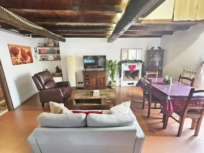 a living room with a couch and a table at Pantheon Penthouse in Rome