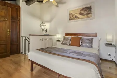 a bedroom with a large bed in a room at Pantheon Penthouse in Rome