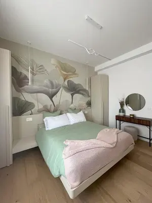 a bedroom with a bed with a painting on the wall at Saint Paul Gateway in Rome