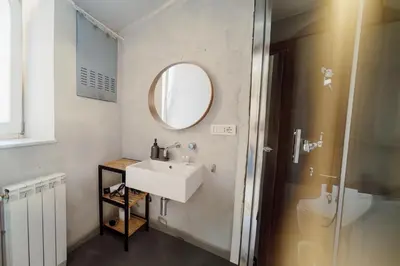 a bathroom with a sink and a mirror at Monti Urban Loft by Valentina's Dream in Rome