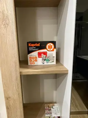a box on a shelf in a room at SAINT PETER home and holiday apartment in Rome