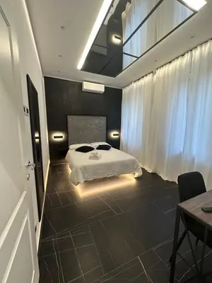a bedroom with a bed with towels on it at Medaglie d'Oro Vaticano in Rome