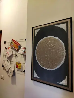 a painting of a circle on a wall in a room at Garbatella, lovely mini apartment in Rome