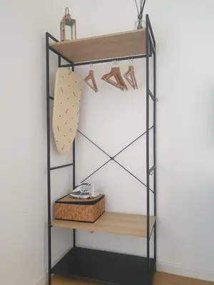 a shelf with shoes and a basket on it at Rienzo Apartment near Vatican in Rome