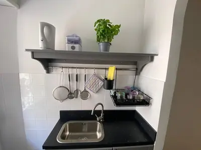 a kitchen counter with a sink and a shelf at Armandino's sweet home Roma in Rome
