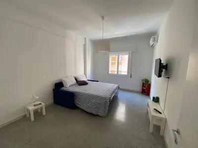 a small bedroom with a bed and a window at Armandino's sweet home Roma in Rome