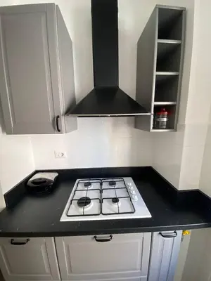 a kitchen with a stove top in a kitchen at Armandino's sweet home Roma in Rome