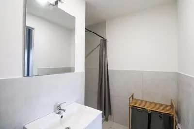 a bathroom with a sink and a shower at Modern Deluxe 2 Suites Apartment - 15min Colosseum & Metro 5min - AC, Wifi in Rome