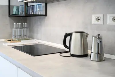 a tea kettle on a counter in a kitchen at Domus suites in Rome